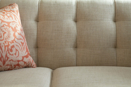 Fabric sofa with decorative pillow