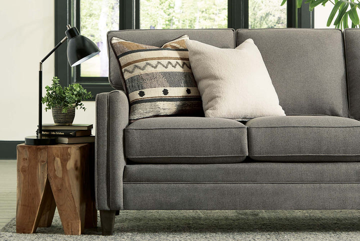 Smith Brothers sofa with gray fabric and decorative pillows